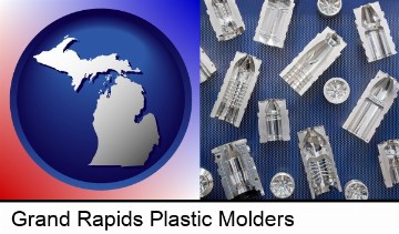 several plastic molds, made from machined metal in Grand Rapids, MI